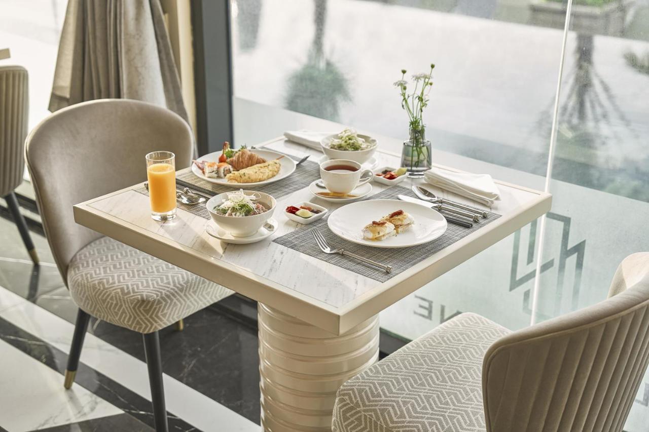 La Siesta Premium Saigon Hotel Ho Chi Minh City Exterior photo A table set for breakfast